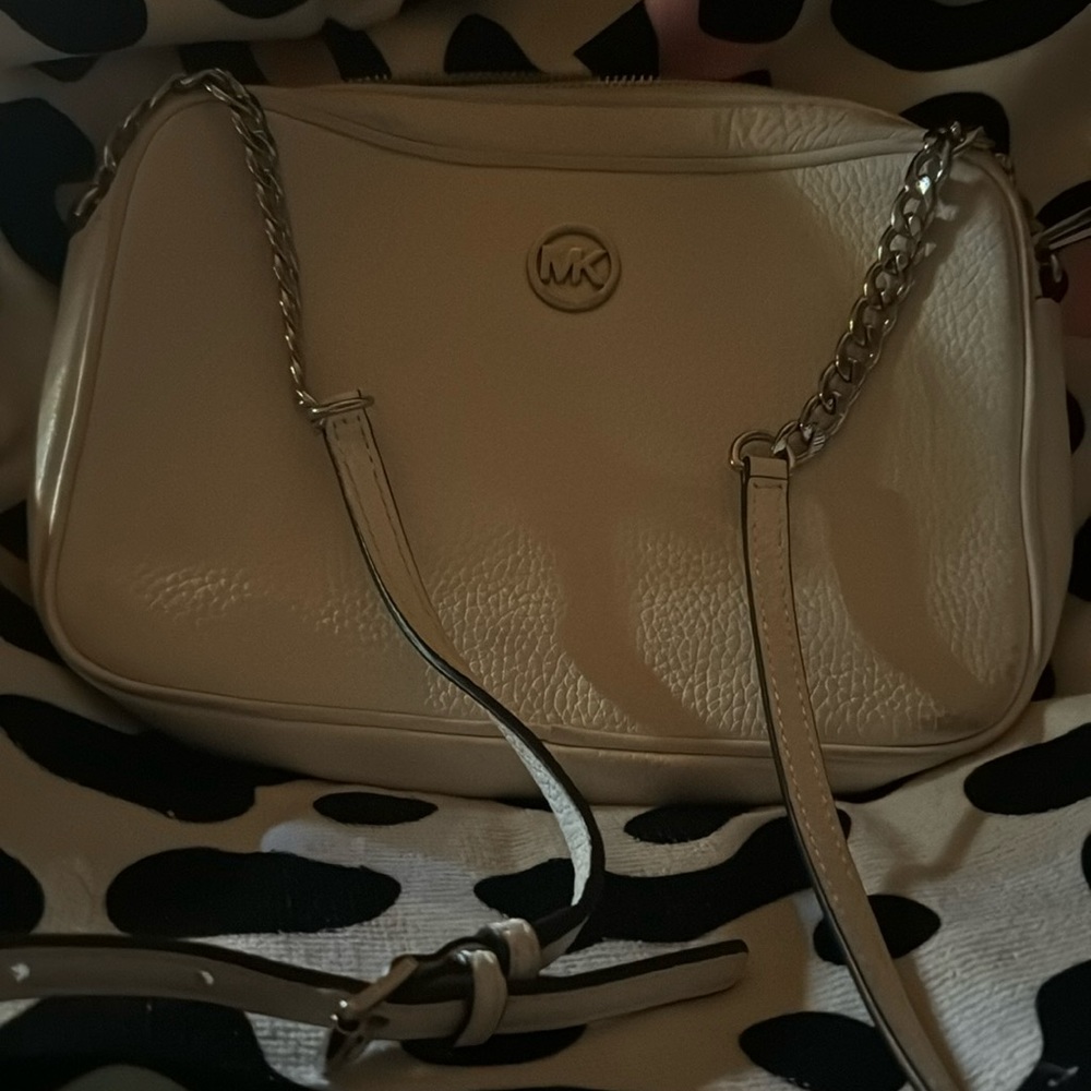 Michael korr mdm sized white crossbody handbag back pocket and roomy inside
